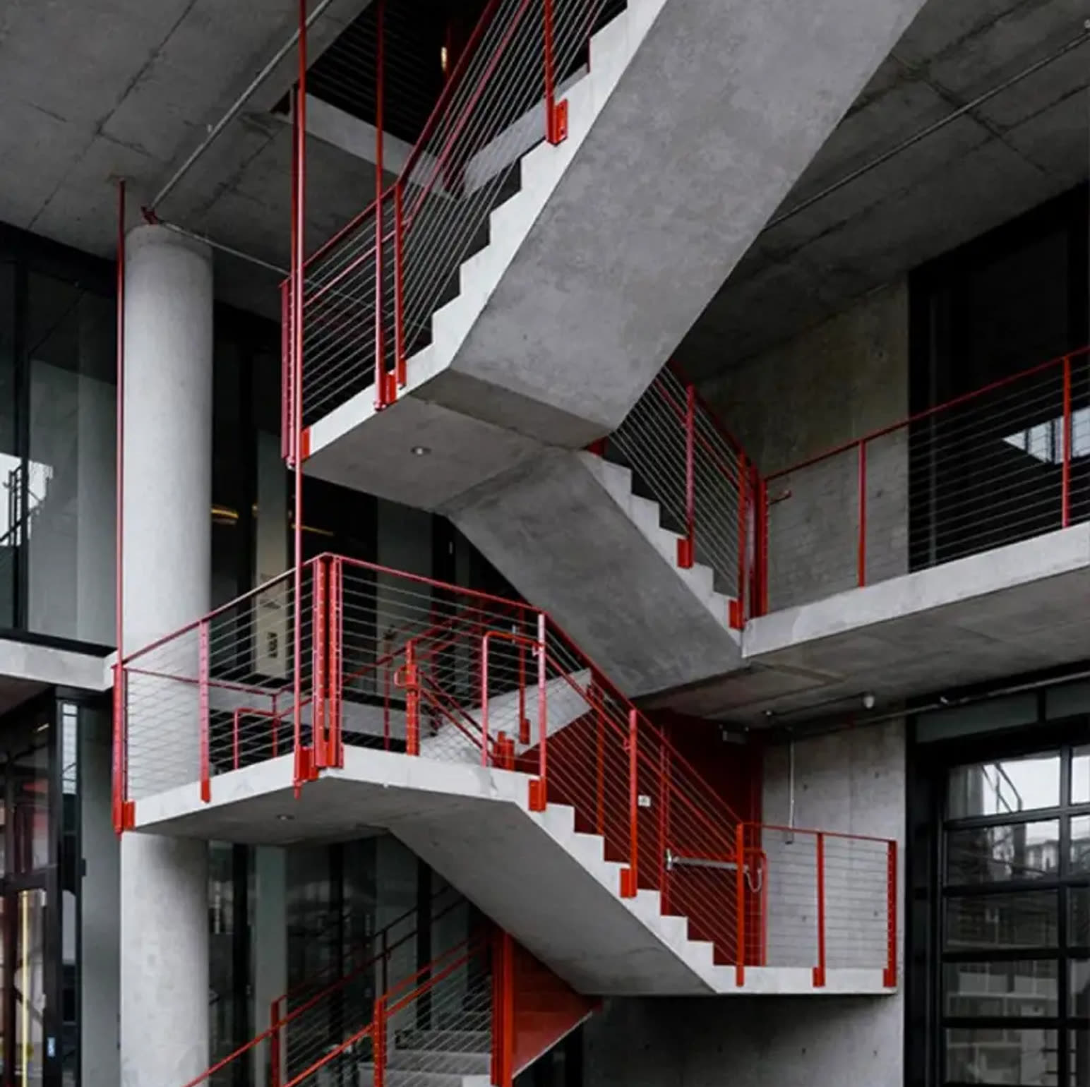 Concrete stairwell with red balustrades